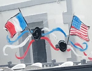 French and American Flags Painted on Café Window in Grandchamp-Maissey