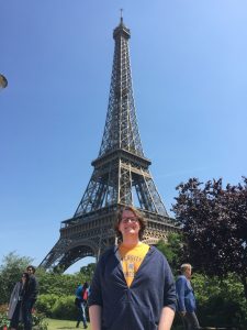 Pictured is the author of this post, Jay Hearn, in front of the Eiffel Tower wearing a University of Tennessee-Knoxville t-shirt.