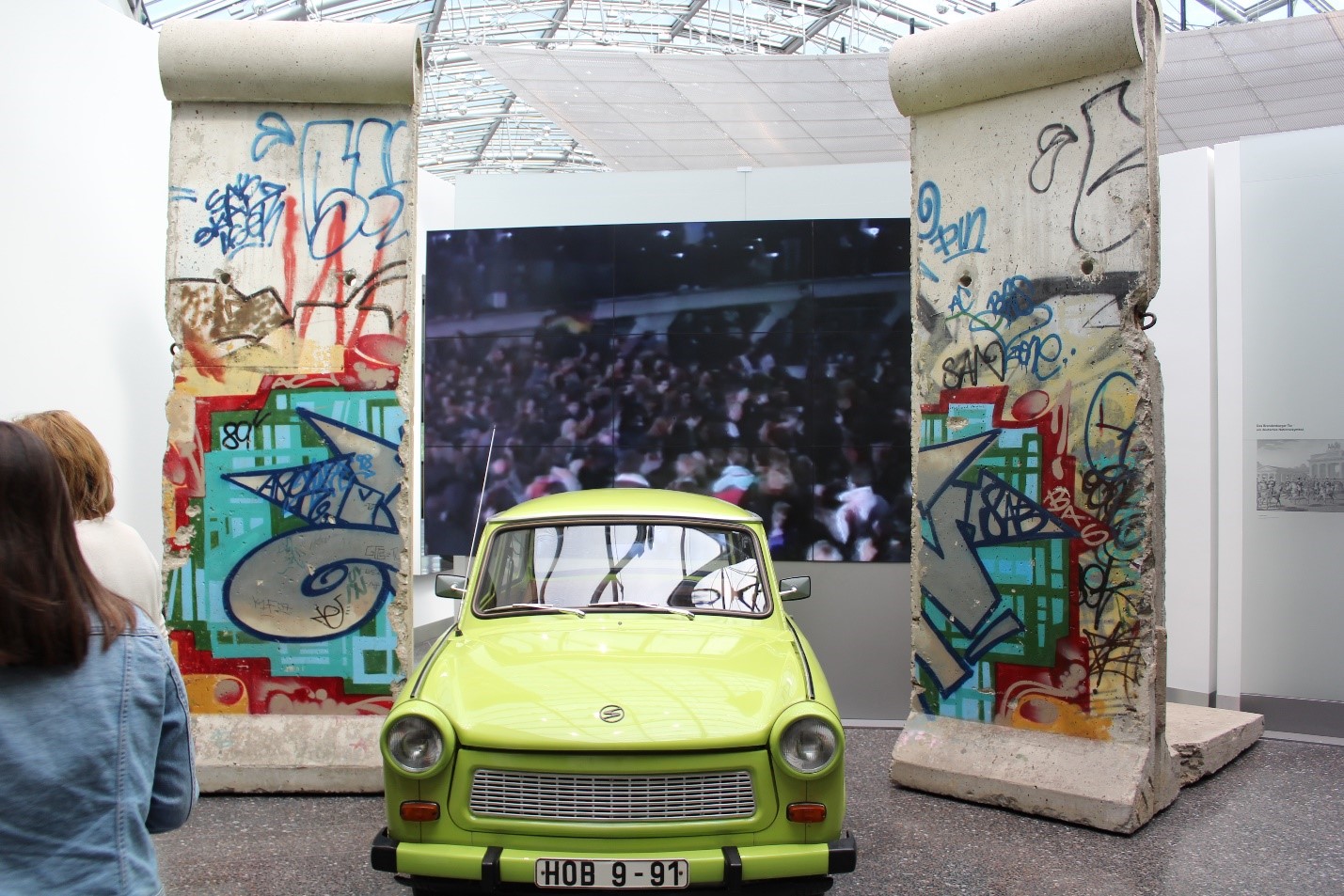 part of the Berlin wall and a car