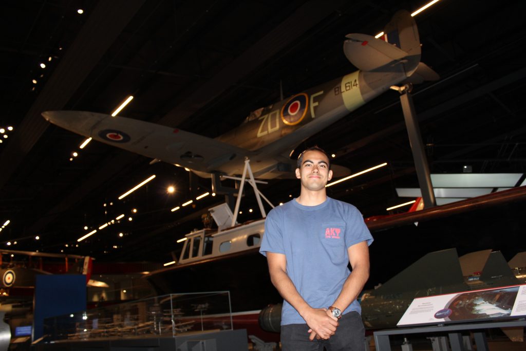 Raman in front of a Spitfire in the RAF museum