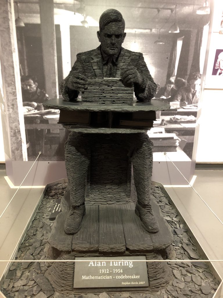 Sculpture of Alan Turing, crafted from fragments of limestone chat pieces.